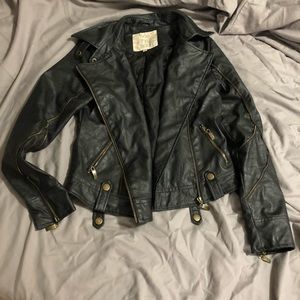 Leather jacket with gold zippers